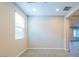 Well-lit bedroom with plush carpet and ample natural light from a large window at 3386 E Strawberry Dr, Gilbert, AZ 85298