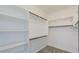 Spacious walk-in closet offers ample storage space with built-in shelving and rods at 3386 E Strawberry Dr, Gilbert, AZ 85298