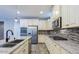 Beautiful kitchen featuring granite countertops, stainless steel appliances, and ample cabinet space at 3386 E Strawberry Dr, Gilbert, AZ 85298