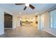 Spacious living room offering a view of the open-concept kitchen with pendant lighting at 3386 E Strawberry Dr, Gilbert, AZ 85298