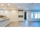 Open-concept living space featuring granite countertops and stylish tile backsplash at 3386 E Strawberry Dr, Gilbert, AZ 85298
