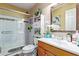 Bathroom with a glass shower door, and a wooden vanity at 3411 W Redfield Rd, Phoenix, AZ 85053