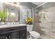 Modern bathroom with a glass-enclosed shower, marble countertop, and stylish decor at 3411 W Redfield Rd, Phoenix, AZ 85053