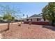 Charming home featuring desert landscaping, a brick facade, and lush mature trees at 3411 W Redfield Rd, Phoenix, AZ 85053