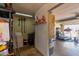 View of the garage space with washer, dryer, shelves, and a treadmill at 3411 W Redfield Rd, Phoenix, AZ 85053