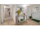 Hallway featuring a console table with decor, tile flooring, and closet doors at 3411 W Redfield Rd, Phoenix, AZ 85053