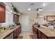 Spacious kitchen featuring granite countertops, and modern appliances at 3411 W Redfield Rd, Phoenix, AZ 85053