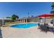 Sparkling pool with outdoor furniture, perfect for entertaining and enjoying sunny days at 3411 W Redfield Rd, Phoenix, AZ 85053
