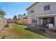 Well-maintained backyard featuring a green lawn, wooden fence, and a covered patio with sliding glass doors at 3732 W Bluefield Ave, Glendale, AZ 85308