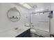 Modern bathroom featuring tiled shower, updated fixtures, subway tile backsplash, mirror, and neutral finishes at 3732 W Bluefield Ave, Glendale, AZ 85308