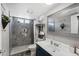 A well-lit bathroom that boasts modern fixtures, shower, mirror, and clean finishes at 3732 W Bluefield Ave, Glendale, AZ 85308
