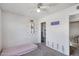 Cozy bedroom featuring a ceiling fan, closet, butterflies on the wall, and carpet flooring at 3732 W Bluefield Ave, Glendale, AZ 85308
