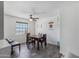 The dining room includes a wooden table, four chairs, a ceiling fan, and decorative flooring at 3732 W Bluefield Ave, Glendale, AZ 85308