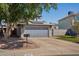 Home featuring a two-car garage, solar panels, and well-maintained landscaping at 3732 W Bluefield Ave, Glendale, AZ 85308
