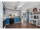 Charming kitchen featuring blue cabinets, modern appliances, and a convenient breakfast bar at 3732 W Bluefield Ave, Glendale, AZ 85308