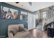 Cozy living room featuring comfortable seating and stylish decor with a staircase to the upper floor at 3732 W Bluefield Ave, Glendale, AZ 85308