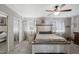 Spacious main bedroom with neutral tones, carpeted floors, ceiling fan, and closet at 3732 W Bluefield Ave, Glendale, AZ 85308