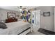 Comfortable bedroom with modern decor, ensuite bathroom, and neutral color scheme with a geometric wall accent at 3732 W Bluefield Ave, Glendale, AZ 85308