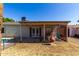 Charming backyard with covered patio, grass and views of the pool at 3828 W Crocus Dr, Phoenix, AZ 85053