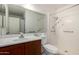 Clean bathroom with a vanity, toilet, and a shower stall with grab bars at 3828 W Crocus Dr, Phoenix, AZ 85053