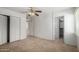 Neutral bedroom featuring closet space and tile flooring at 3828 W Crocus Dr, Phoenix, AZ 85053