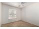 Bedroom with a window and tile floors at 3828 W Crocus Dr, Phoenix, AZ 85053
