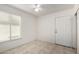 Cozy bedroom with window, ceiling fan, neutral colors and tile flooring at 3828 W Crocus Dr, Phoenix, AZ 85053