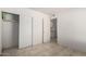 Bedroom with closet, coat hooks and access to the kitchen at 3828 W Crocus Dr, Phoenix, AZ 85053