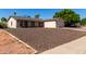 Beautiful home boasting a two-car garage and low-maintenance gravel front yard at 3828 W Crocus Dr, Phoenix, AZ 85053