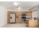 Well-lit kitchen featuring stainless steel appliances, light wood cabinets, and tile floors at 3828 W Crocus Dr, Phoenix, AZ 85053