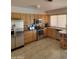 Well-lit kitchen featuring stainless steel appliances and tiled flooring at 3828 W Crocus Dr, Phoenix, AZ 85053