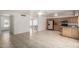 Open floor plan view of the kitchen featuring light wood cabinets and tile floors at 3828 W Crocus Dr, Phoenix, AZ 85053