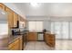 Cozy kitchen with stainless steel appliances and light wood cabinets at 3828 W Crocus Dr, Phoenix, AZ 85053