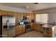 Functional kitchen featuring oak cabinets and stainless steel appliances at 3828 W Crocus Dr, Phoenix, AZ 85053