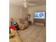 Inviting living room featuring a ceiling fan and comfortable seating arrangement at 3828 W Crocus Dr, Phoenix, AZ 85053