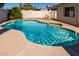 Refreshing backyard pool features a tanning ledge and clear blue water, perfect for outdoor relaxation and recreation at 3828 W Crocus Dr, Phoenix, AZ 85053