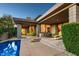 Inviting back patio featuring a pool, covered lounge area, and seamless indoor-outdoor living at 39541 N 107Th Way, Scottsdale, AZ 85262