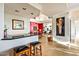Elegant bar area with granite countertop flows into living room and kitchen for seamless entertaining at 39541 N 107Th Way, Scottsdale, AZ 85262