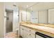 Bright bathroom with a walk-in shower and vanity with tile counters and ample storage space at 39541 N 107Th Way, Scottsdale, AZ 85262