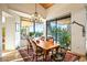 Inviting dining room with great natural light from the large window and sliding glass door at 39541 N 107Th Way, Scottsdale, AZ 85262