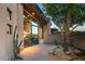 Stylish home exterior showcasing modern architecture, desert landscaping, and a private outdoor seating area at 39541 N 107Th Way, Scottsdale, AZ 85262