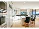 Bright kitchen featuring modern appliances, granite countertops, and an island with bar seating for casual dining at 39541 N 107Th Way, Scottsdale, AZ 85262