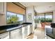 Modern kitchen with granite countertops, white cabinets, stainless steel appliances, and a window with picturesque views at 39541 N 107Th Way, Scottsdale, AZ 85262
