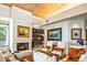 Inviting living room featuring a fireplace, built-in bookshelves, and comfortable seating arrangements at 39541 N 107Th Way, Scottsdale, AZ 85262