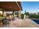 Charming backyard patio adjacent to a refreshing pool area, creating a perfect spot for relaxation and socializing at 39541 N 107Th Way, Scottsdale, AZ 85262