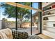 Bright sitting area with a comfortable chair and a large window providing tranquil views of the outdoors at 39541 N 107Th Way, Scottsdale, AZ 85262
