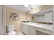 Bathroom with granite-look countertop and bowl sink, decorative mirror, and flower accents at 4034 E Aster Dr, Phoenix, AZ 85032