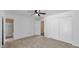 Bedroom with neutral carpet, ceiling fan and ensuite bathroom at 4034 E Aster Dr, Phoenix, AZ 85032