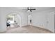 Open bedroom with an arched opening leading to additional living area at 4034 E Aster Dr, Phoenix, AZ 85032