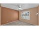 Comfortable bedroom featuring a ceiling fan and a window providing natural light at 4034 E Aster Dr, Phoenix, AZ 85032